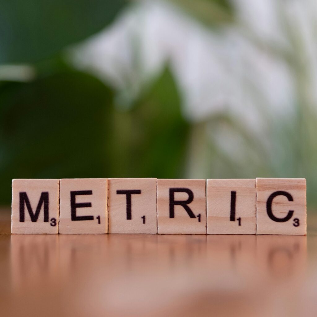 wooden-tiles-spelling-metric-on-table-surface
